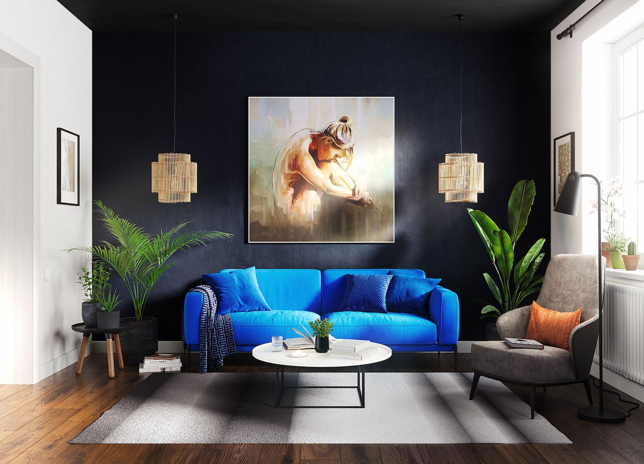 Urban Serenity interior — modern living room with a bright blue sofa, dark accent wall, pendant lights, indoor plants, and wall art.